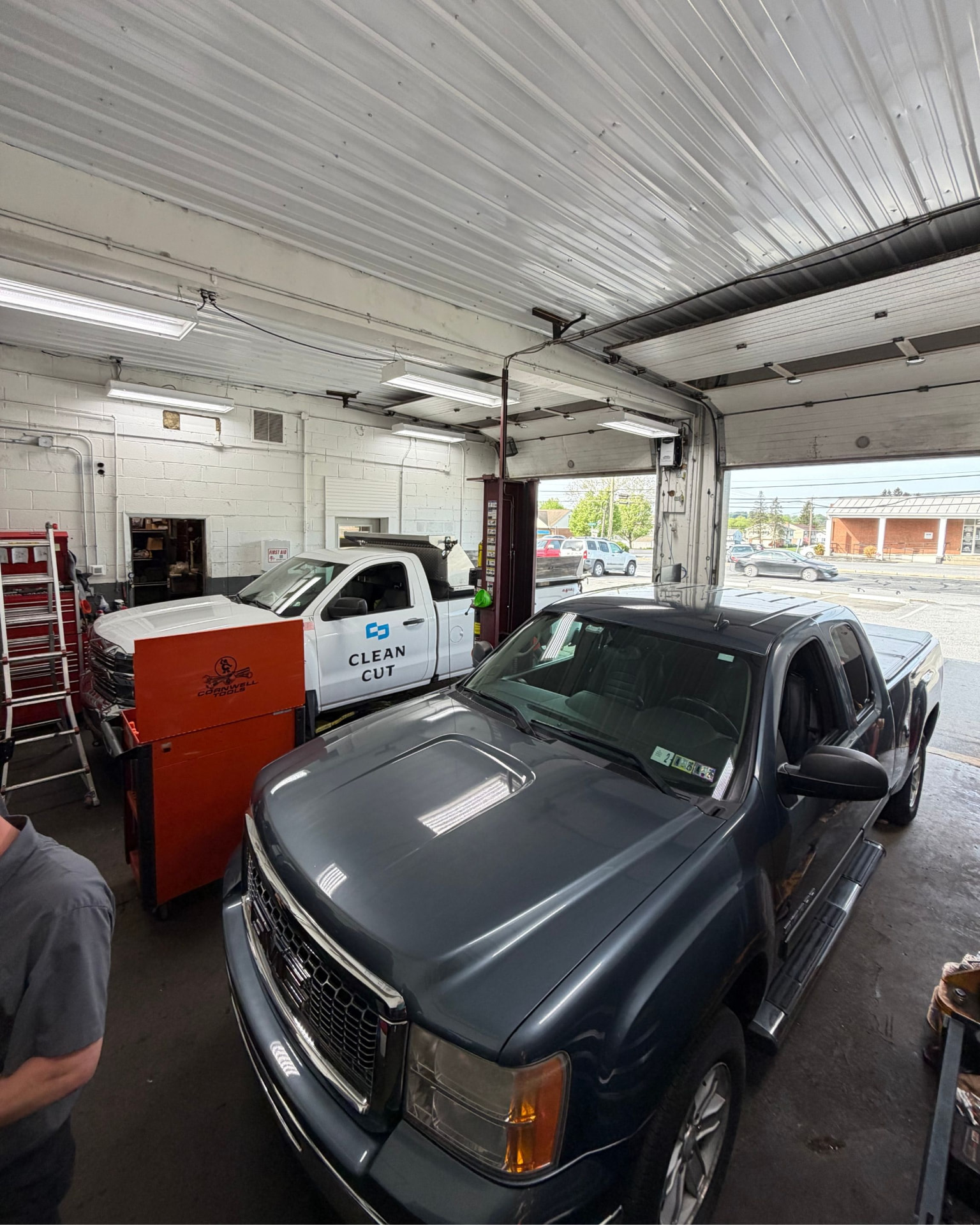 Keystone Automotive Repair service bay with a vehicle on the lift